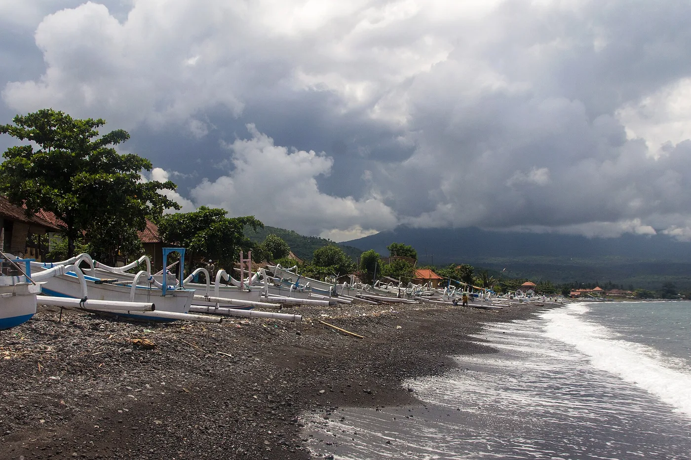 Traditional jukung fishing boats on the black-sand beach at Amed
