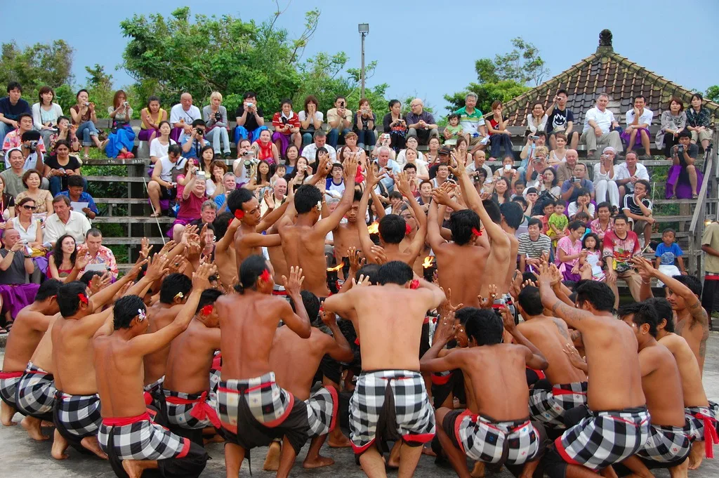 Dancers performing the Kecak in a ring at Uluwatu Temple's clifftop amphitheatre