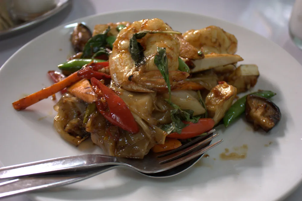 A plate of phat khi mao — drunken noodles with prawns, chillies and holy basil — at Raan Jay Fai