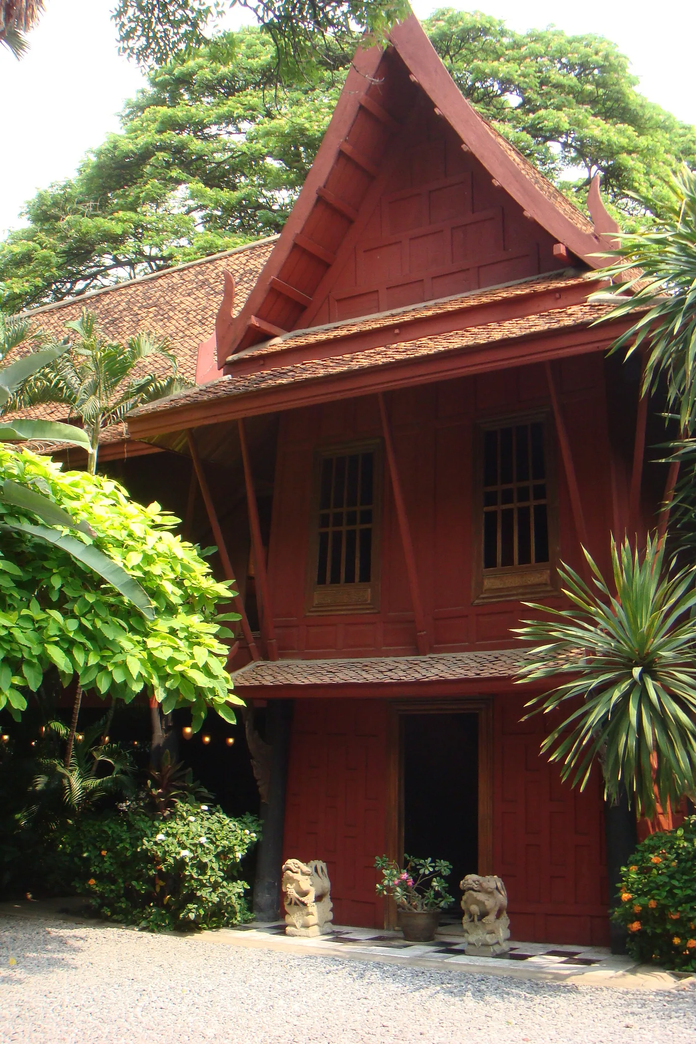 The traditional red-teak Jim Thompson House and its tropical garden