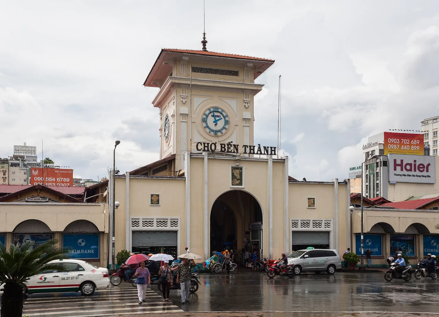 The clock-tower entrance of Ben Thanh Market on a rainy day