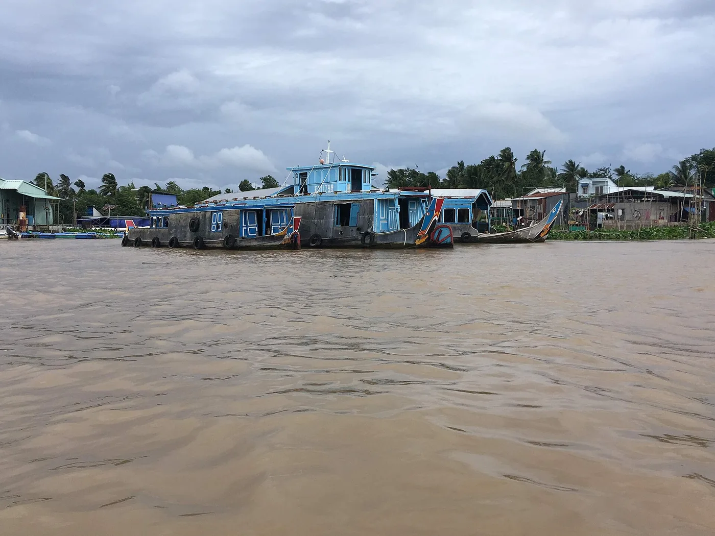 Wooden river boats on the Mekong near Can Tho