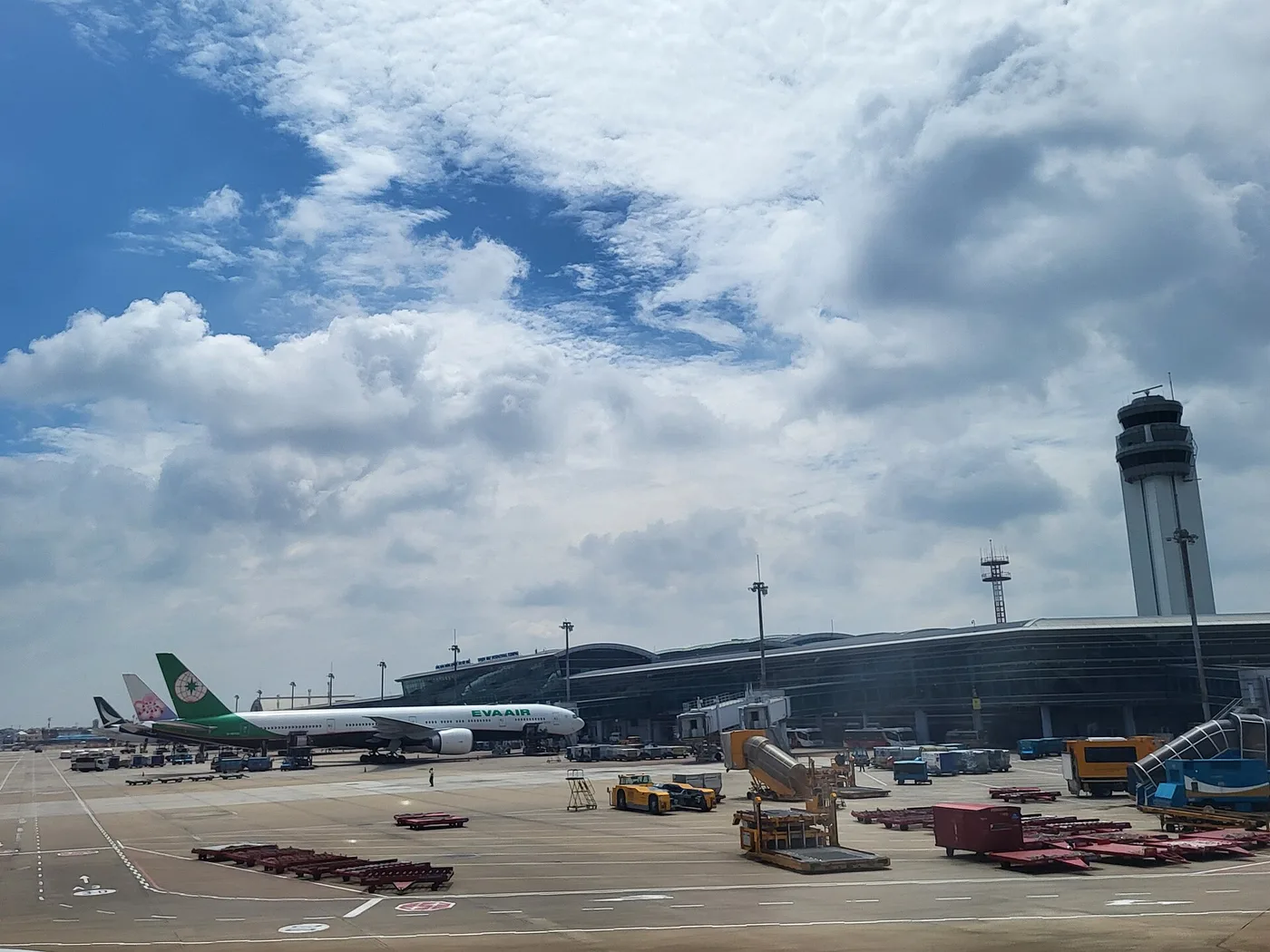 The apron at Tan Son Nhat International Airport's terminal, with parked jets and a control tower