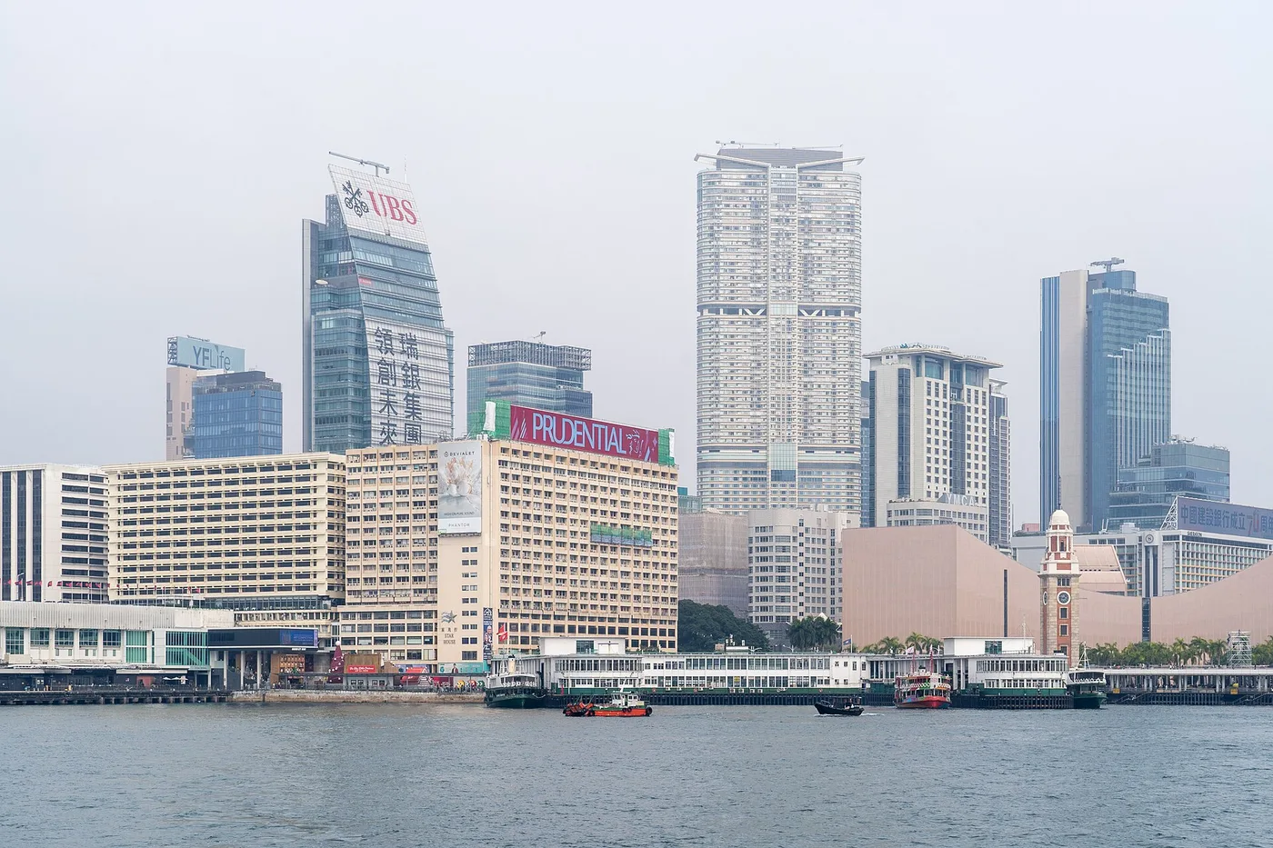 Star Ferries at the Tsim Sha Tsui pier with the Kowloon waterfront behind