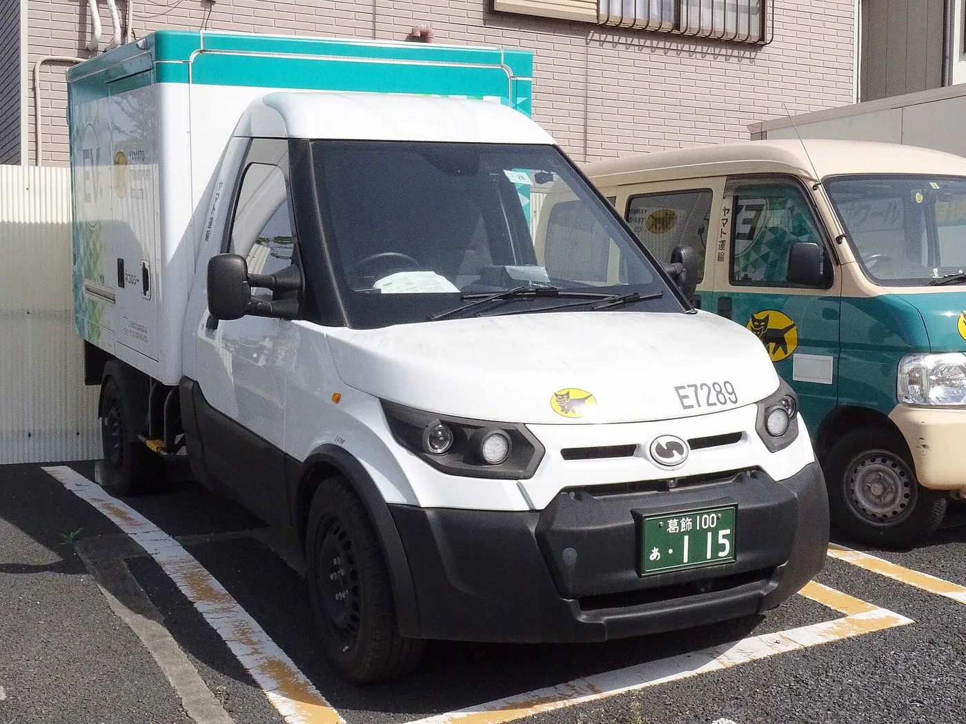 Yamato Transport delivery vans in their black-cat livery