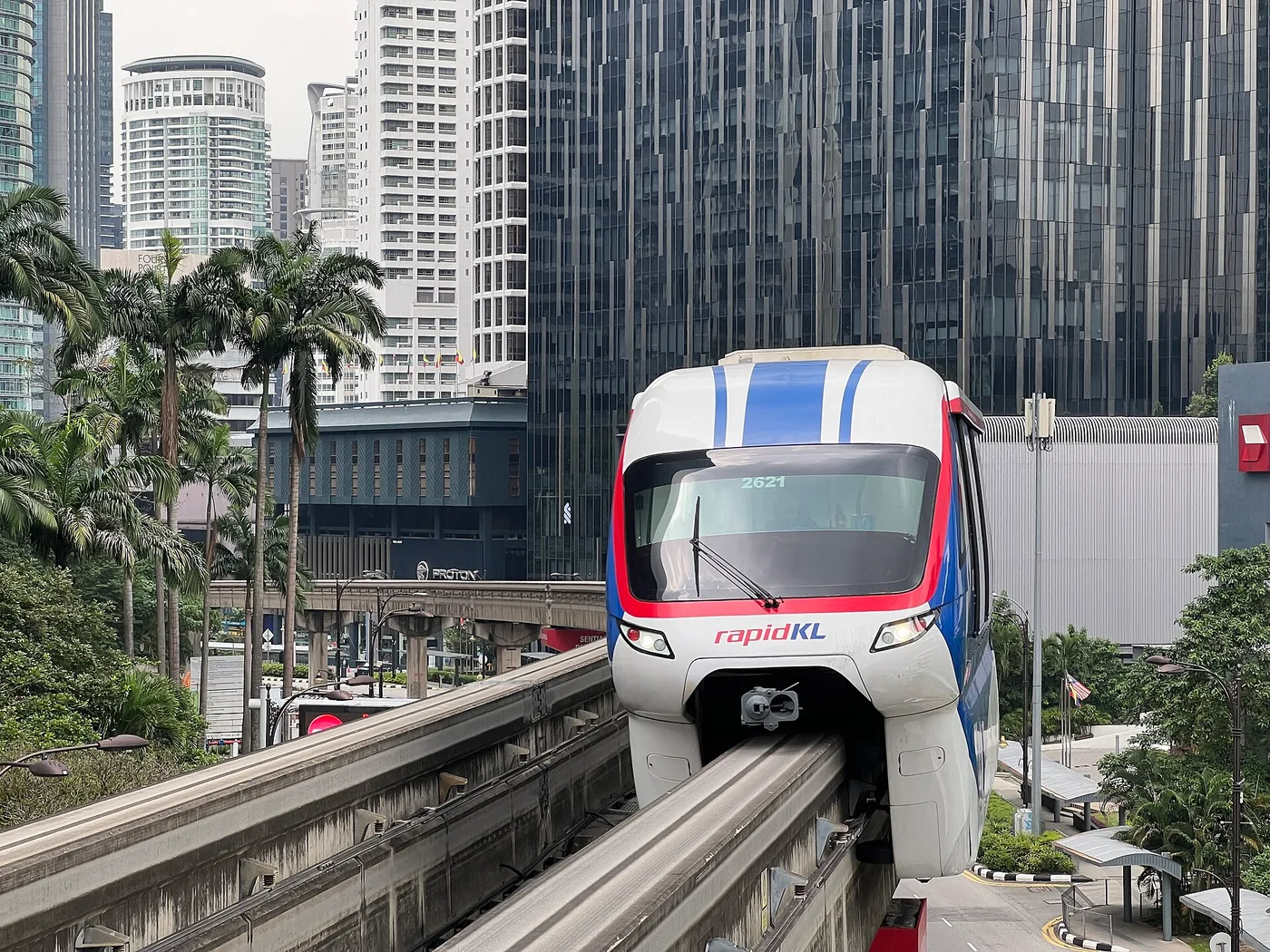 A Rapid KL Monorail train arriving on the elevated beam, KL towers behind