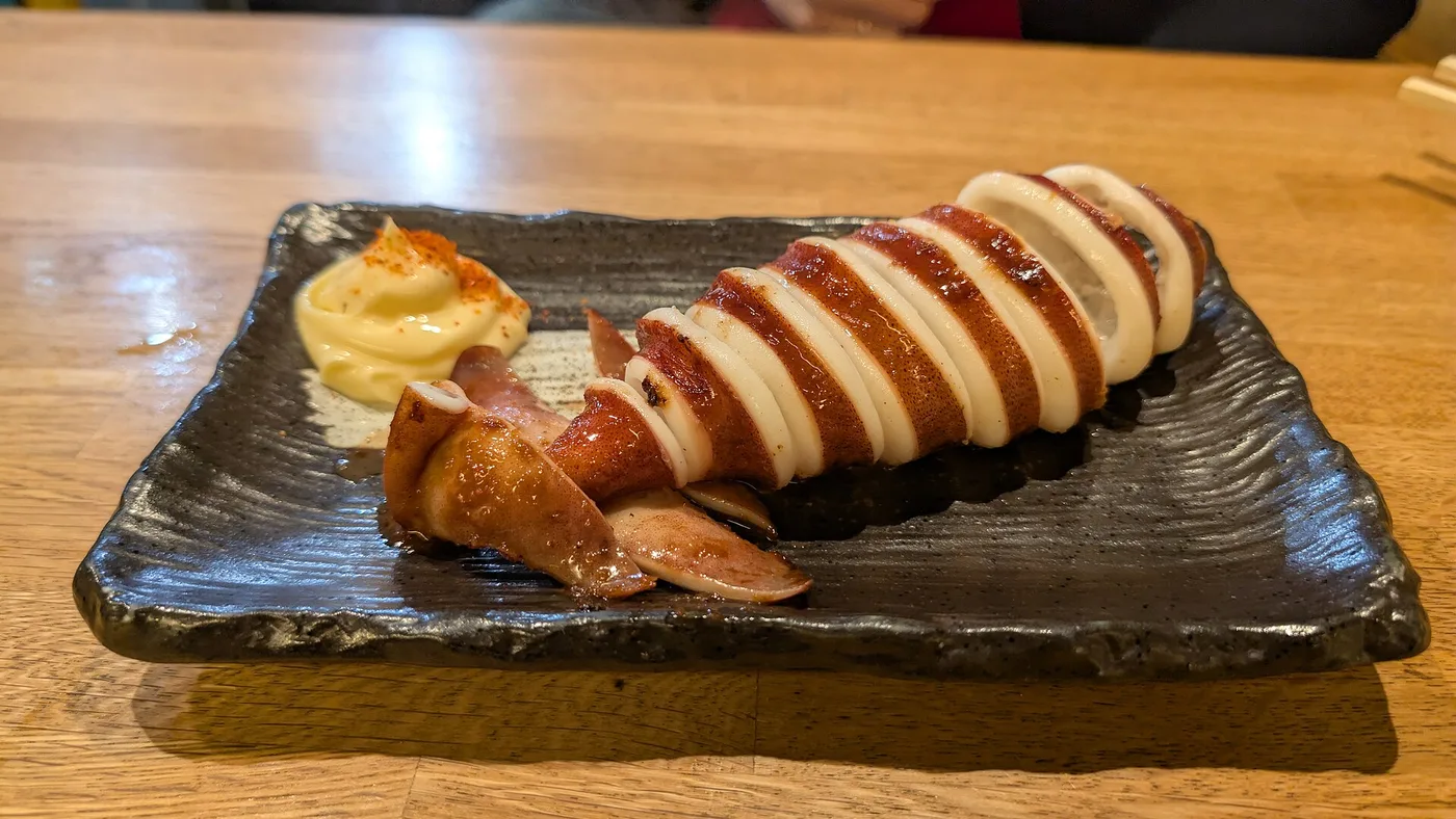 Grilled squid, a Nishiki Market specialty, on a plate