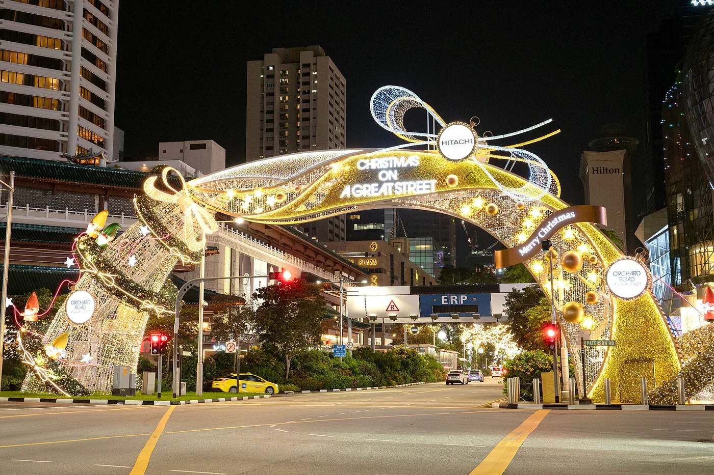 Orchard Road's Christmas light-up — the illuminated 'Christmas on a Great Street' arch over the road at night