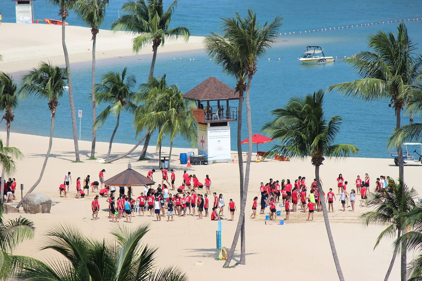 Siloso Beach on Sentosa — palms, a lagoon and a busy activity beach