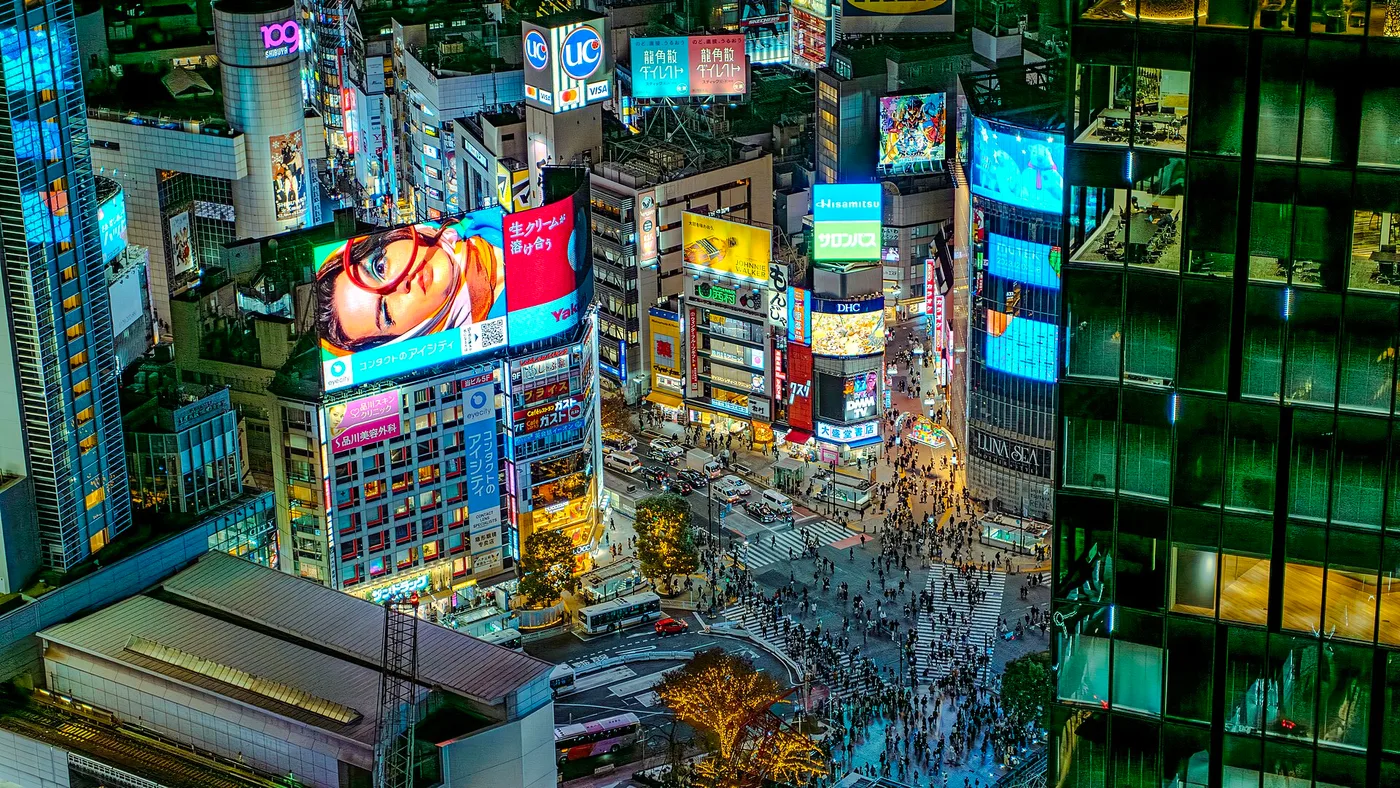 The Shibuya scramble crossing and its neon, seen from above at night